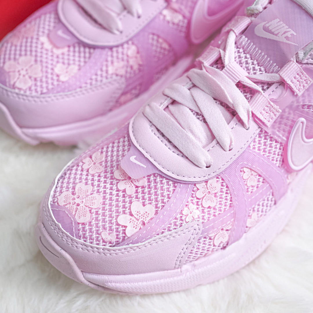 Nike V2K Run Women’s “Pink Foam/Arctic Pink” — pair close-up on pink backdrop